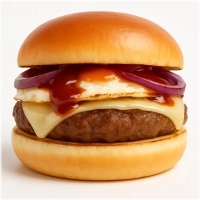 100% rundvlees burger (125 gr.) op een luxe broodje met goudse kaas, gebakken uien, gebakken ei en smokey barbeque saus.