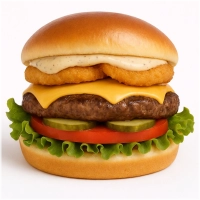 100% rundvlees burger (125 gr.) op een luxe broodje met cheddar, gebakken uienringen, sla, tomaat, augurk en truffel mayonaise.